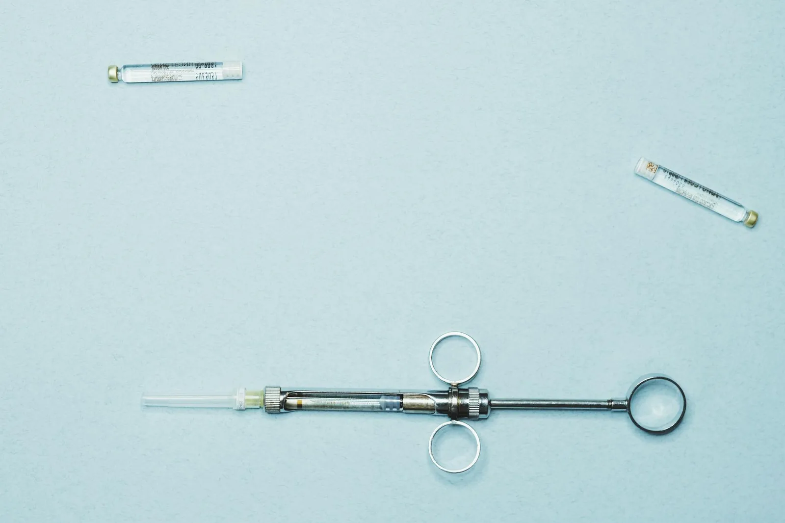 B12 vitamin vials and syringe arranged on a clinical surface for medically supervised injections in Las Cruces, NM